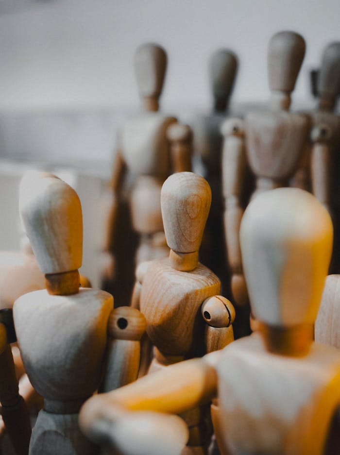 heros-img A close-up of wooden mannequin figurines showcasing craftsmanship and detail.